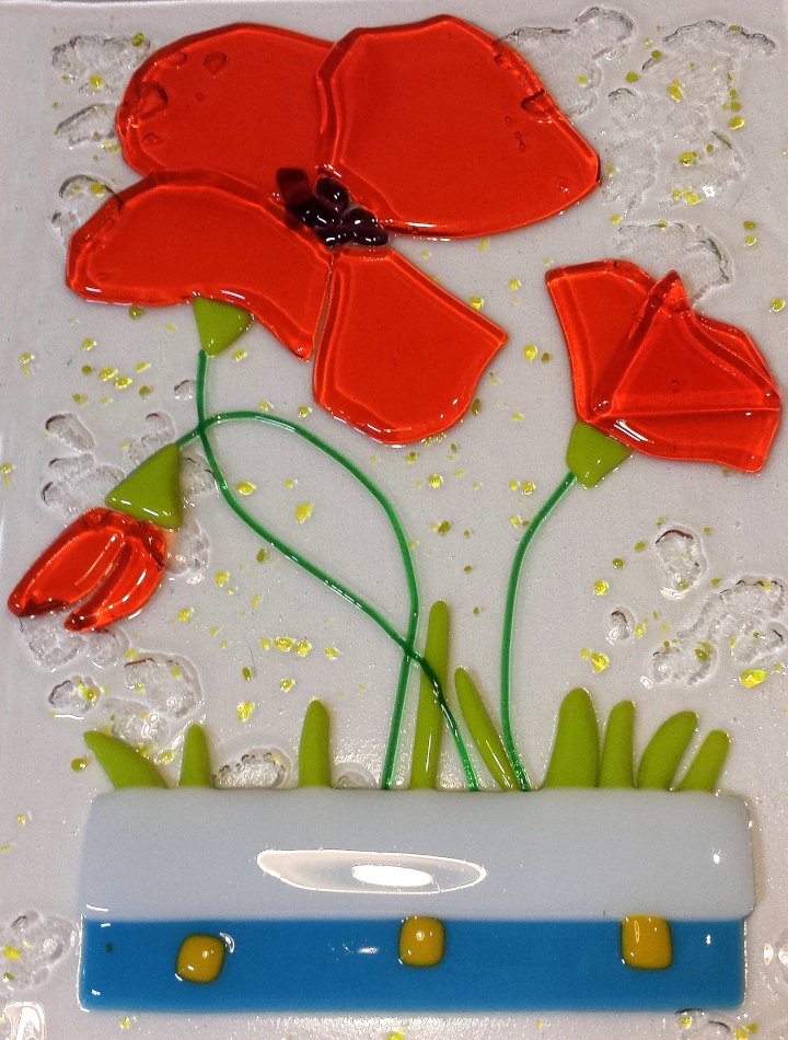Fused glass: image of a window panel with an abstract poppy design